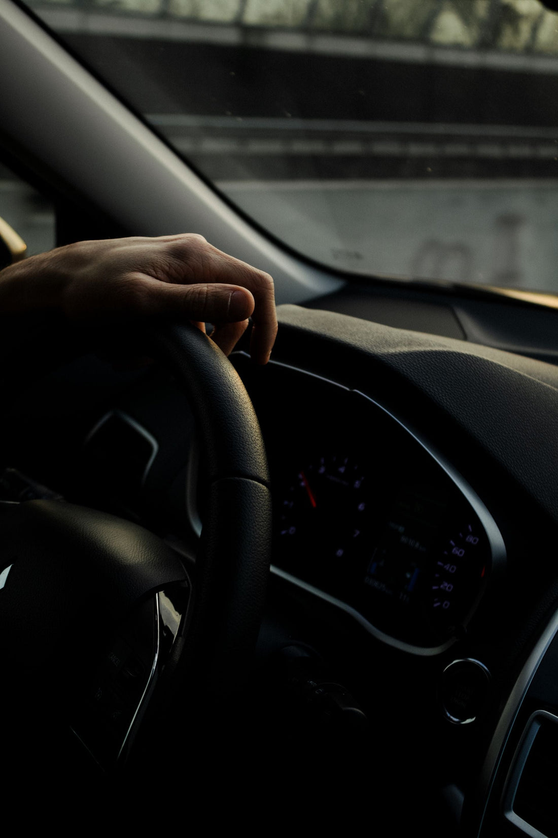 Hand on the steering wheel while driving