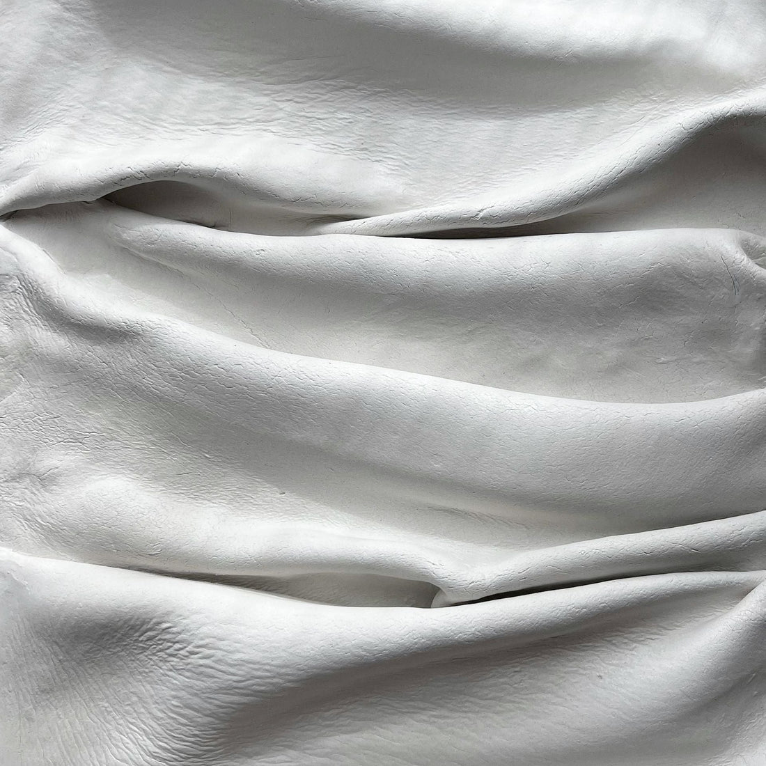 White heavyweight fabric with soft folds