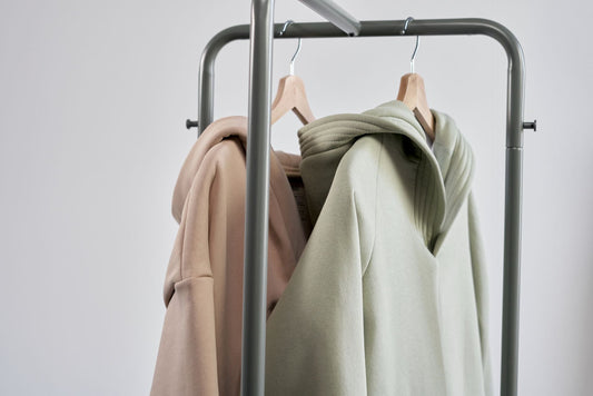 Hoodies hanging on a minimalist clothes rack