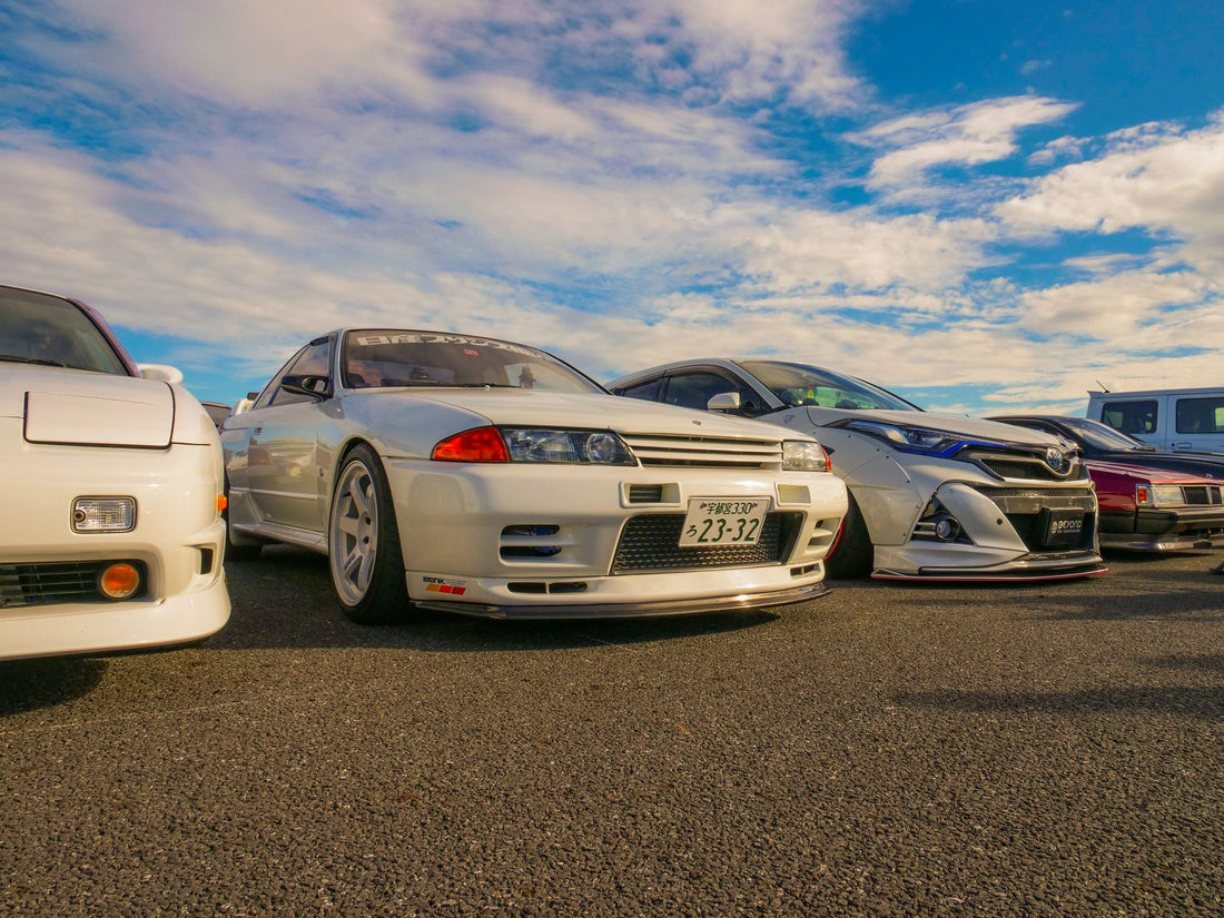 Classic JDM cars lined up at a car meet