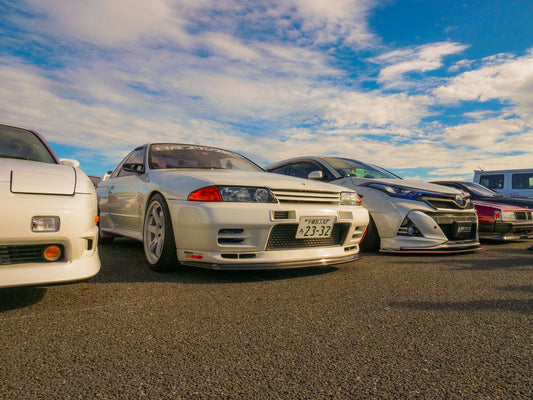 Classic JDM cars lined up at a car meet