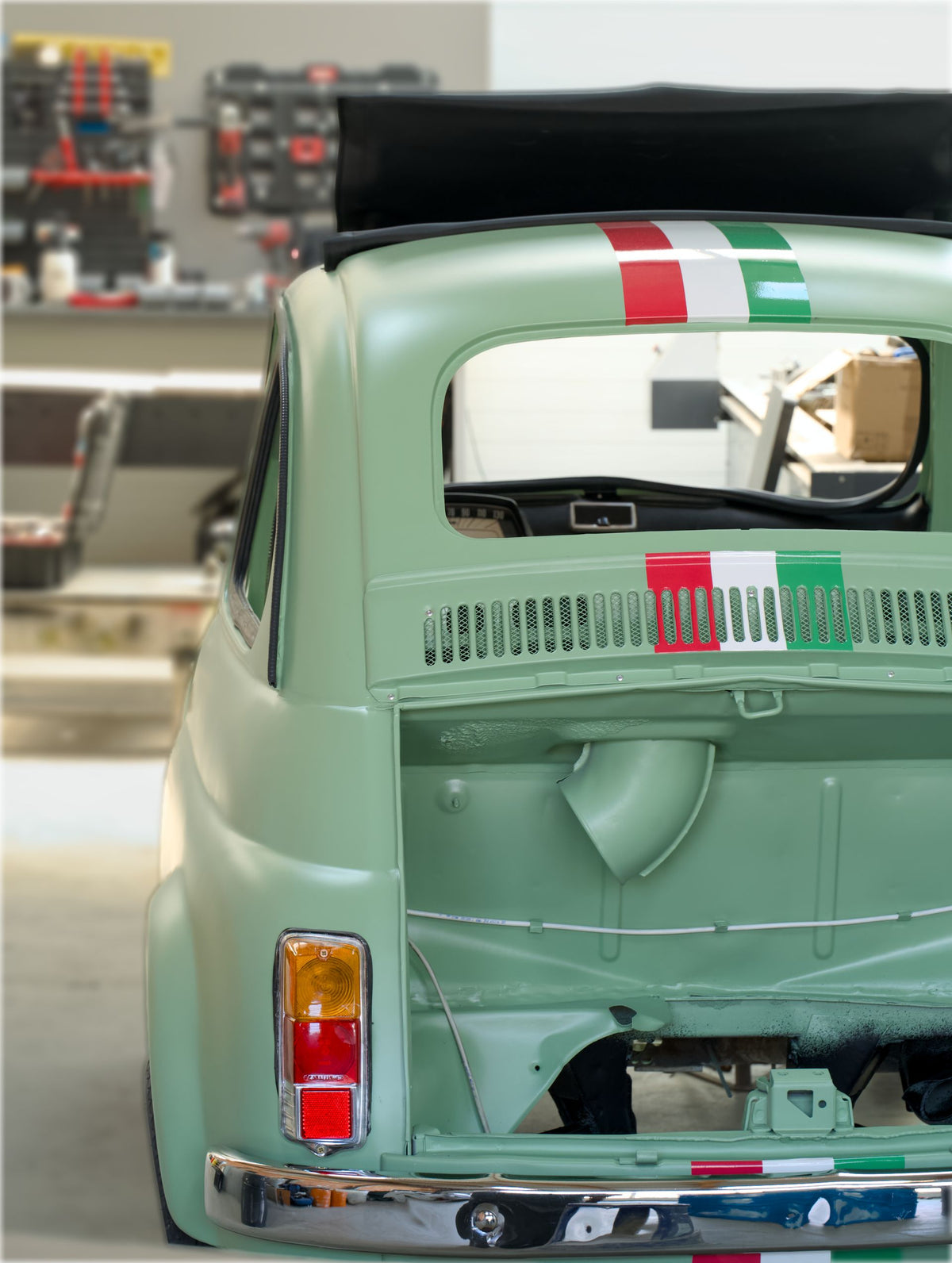 Classic car under restoration in a mechanic's garage